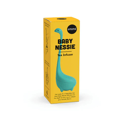 Yellow box with a blue Nessie-shaped tea infuser on a white background